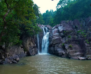 Beautiful view of Ludu Waterfall surrounded by dense forest in Kandhamal Odisha